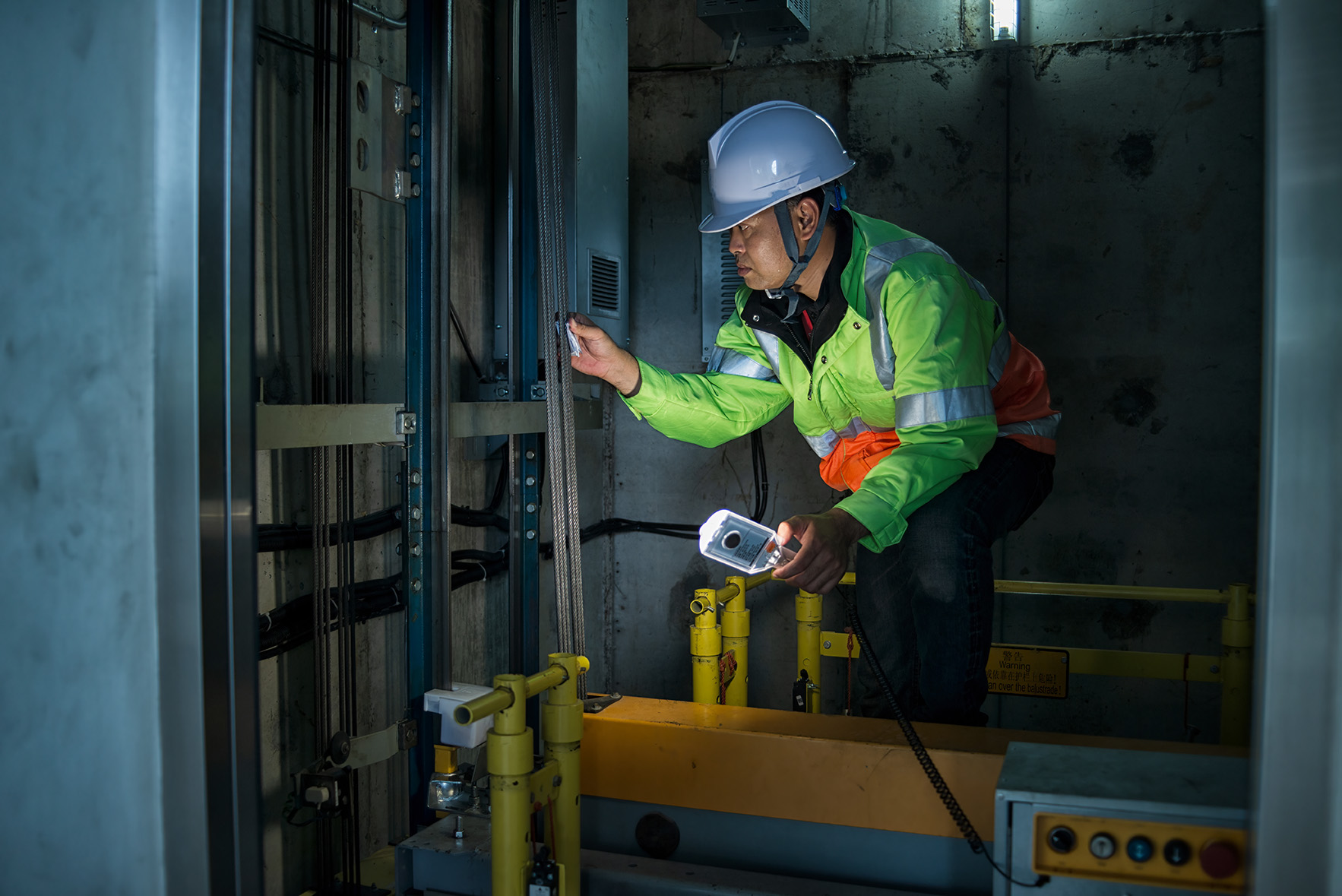 Elevator Services professional using Breezeworks